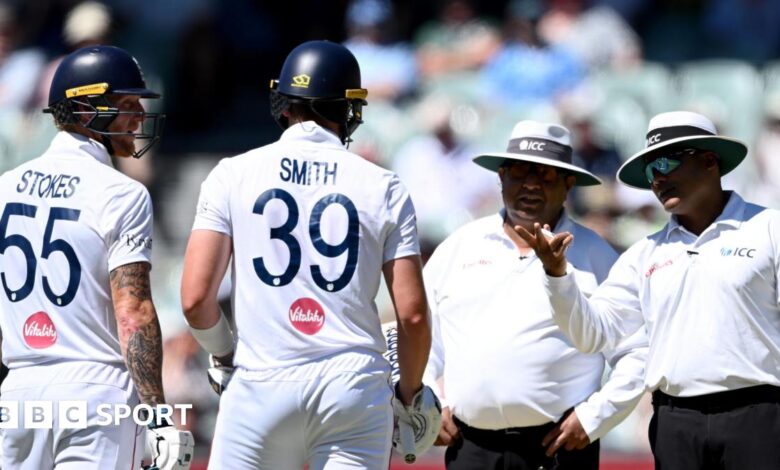 Ben Stokes and Jamie Smith discuss the decisions with the umpires